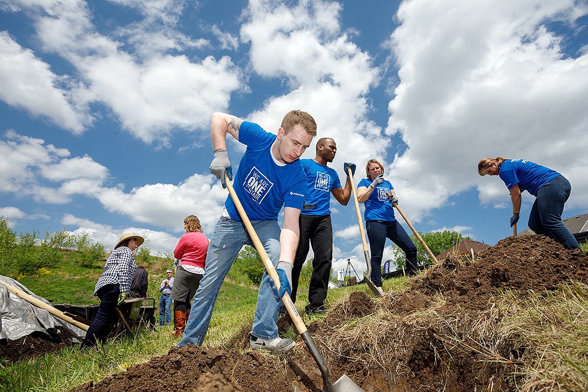 team-pentair-tree-planting-responsibility-grass-blue-green-man-cropped-horizontal-1200x800-image-file